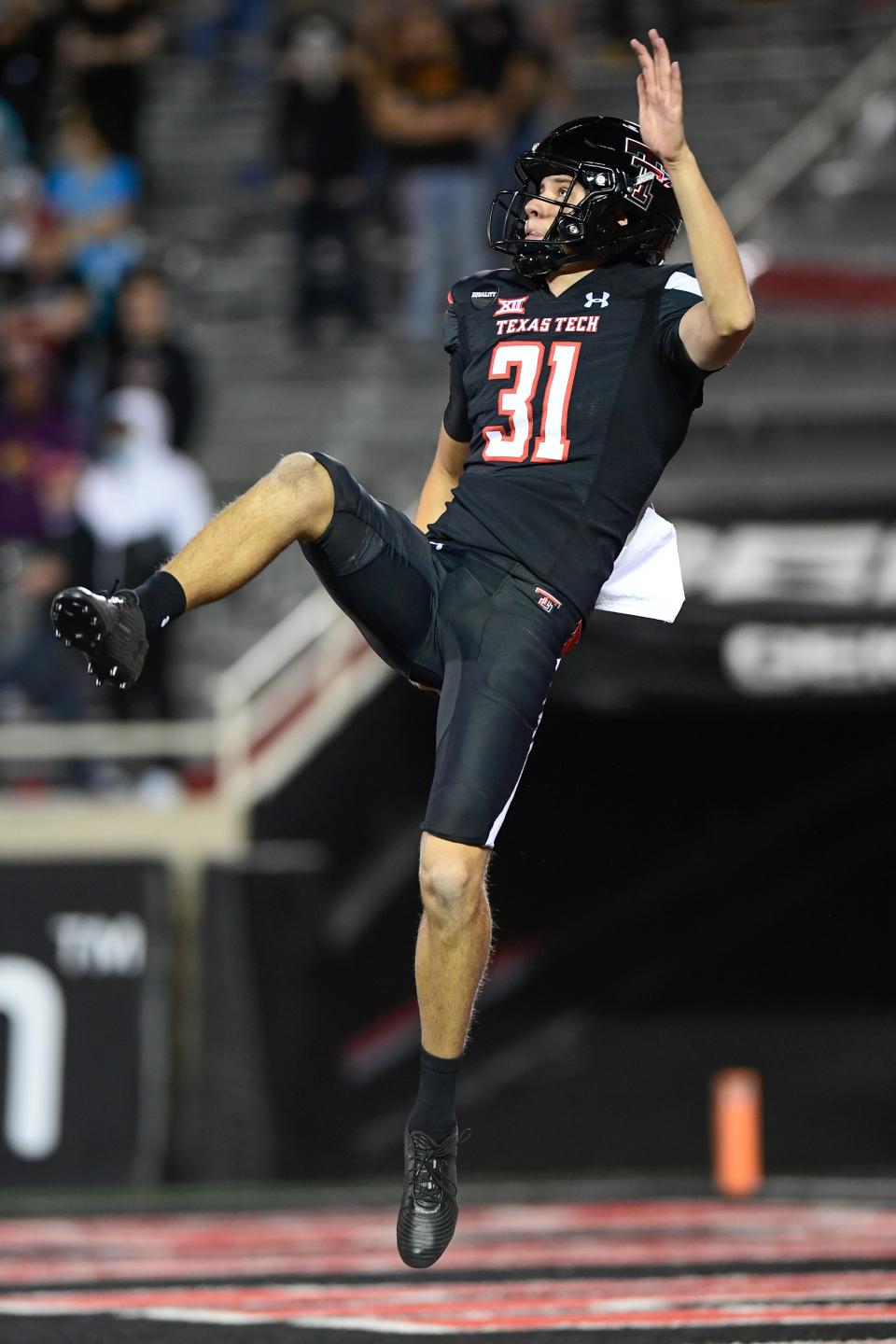 Texas Tech's Austin McNamara (31) punts the ball to Oklahoma on Saturday, Oct. 31, 2020, at Jones AT&T Stadium in Lubbock, Texas.