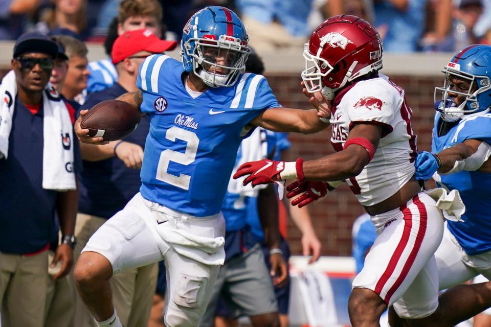 Mississippi Rebels quarterback Matt Corral (2) carries the ball against Arkansas Razorbacks at Vaught-Hemingway Stadium.