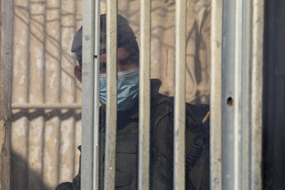 An Israeli soldier stands in the Rosh Hanikra border crossing between Israel and Lebanon in northern Israel, Wednesday, Oct. 14, 2020. Lebanon and Israel began indirect talks Wednesday over their disputed maritime border, with American officials mediating the talks that both sides insist are purely technical and not a sign of any normalization of ties. (AP Photo/Ariel Schalit)