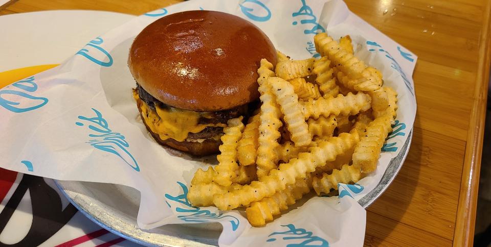 Oasis on Pine Ridge's smashed double cheeseburgers with dijonaise, caramelized onions and wavy pickles on brioche toasted with garlic butter.