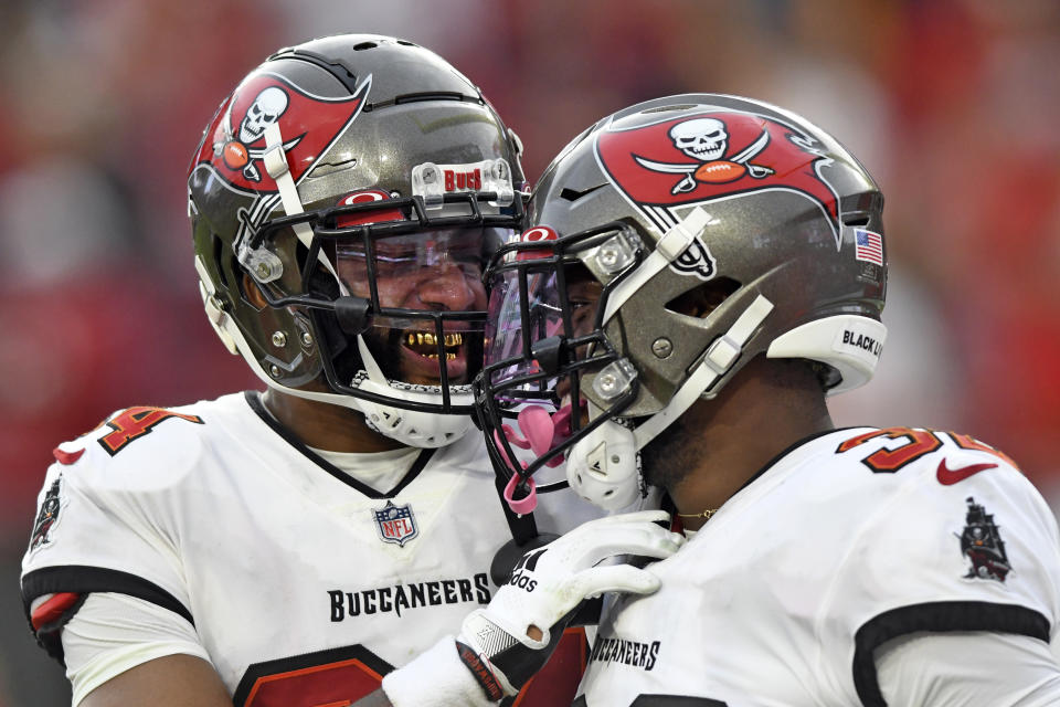 Tampa Bay Buccaneers safety Mike Edwards, right, celebrates with cornerback Carlton Davis III after Edwards returned an interception against the Atlanta Falcons for a score during the second half of an NFL football game Sunday, Sept. 19, 2021, in Tampa, Fla. (AP Photo/Jason Behnken)