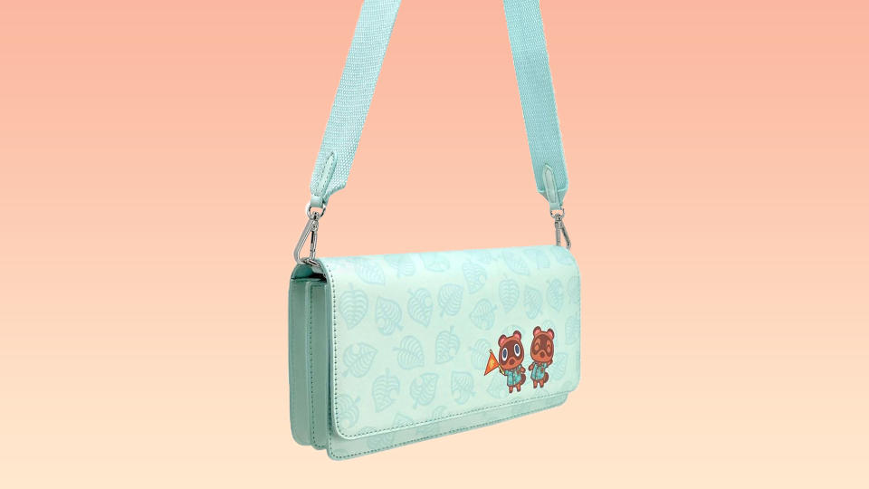 This mint green crossbody bag is perfect for holding a Switch console. (Photo: Target)