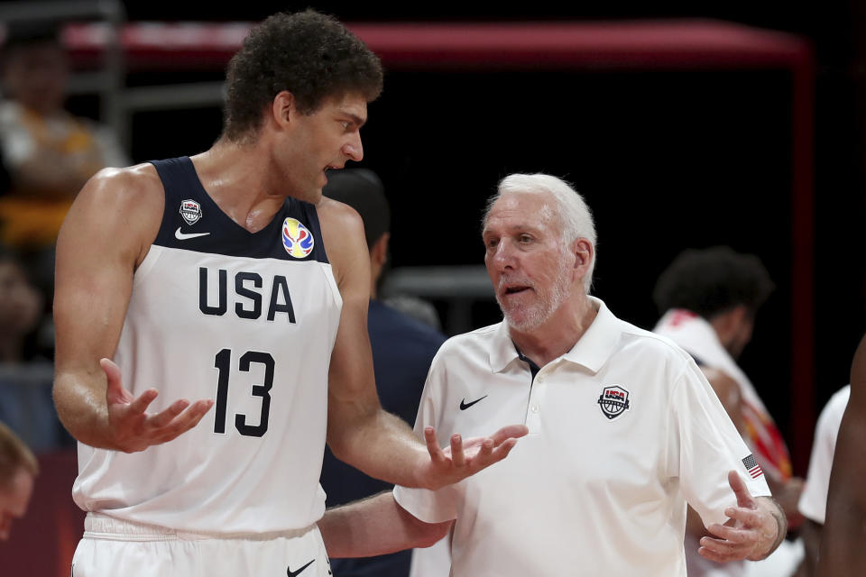 United States' coach Gregg Popovich chats with United States' Brook Lopez during a consolation playoff game against Poland for the FIBA Basketball World Cup at the Cadillac Arena in Beijing on Saturday, Sept. 14, 2019. U.S. defeated Poland 87-74 (AP Photo/Ng Han Guan)