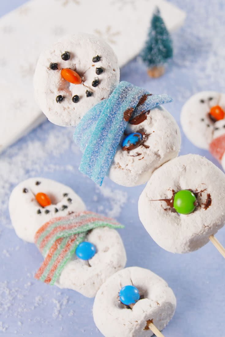 <p>Making snowmen out of <a href="https://www.delish.com/cooking/recipe-ideas/a40010851/powdered-donuts-recipe/" rel="nofollow noopener" target="_blank" data-ylk="slk:powdered donuts;elm:context_link;itc:0;sec:content-canvas" class="link ">powdered donuts</a> is WAY easier (and warmer!) than making them out of snow. We used M&Ms, sour belts, and melted chocolate for ours, but have fun with it and make them your own.</p><p>Get the <strong><a href="https://www.delish.com/cooking/recipe-ideas/recipes/a57148/snowman-donuts-recipe/" rel="nofollow noopener" target="_blank" data-ylk="slk:Snowman Donuts recipe;elm:context_link;itc:0;sec:content-canvas" class="link ">Snowman Donuts recipe</a></strong>.</p>