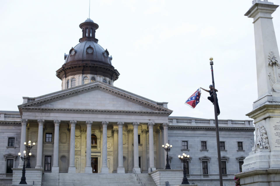 June 27, 2015 — Activist removes Confederate flag from S.C. Statehouse