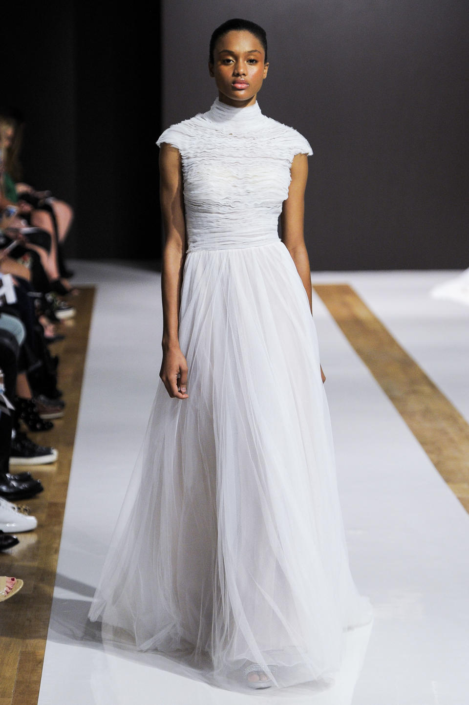 <p>A tulle twist on a style similar to Pippa Middleton says 'covered up but still chic'.</p>