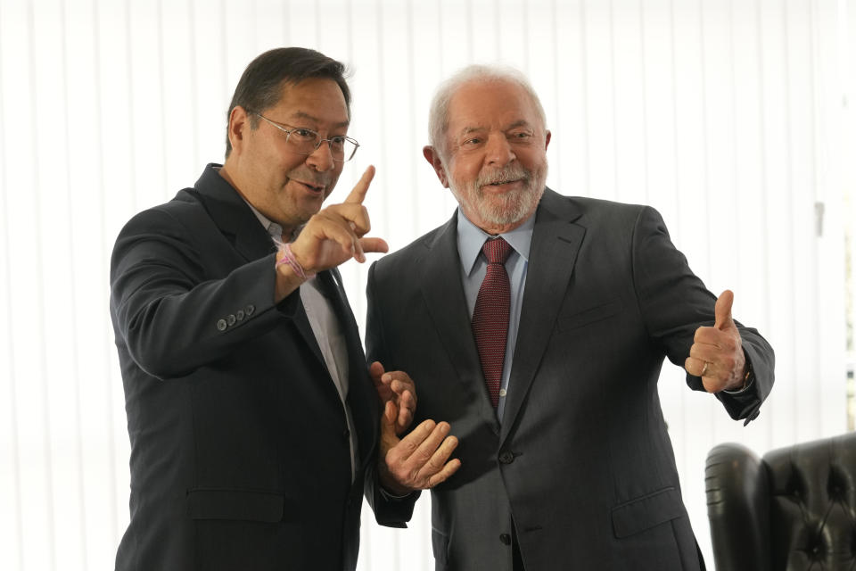 Brazilian President Luiz Inacio Lula da Silva, right, and Bolivia's President Luis Arce pose for photos during a bilateral meeting at Itamaraty Palace the day after Lula's inauguration in Brasilia, Brazil, Monday, Jan. 2, 2023. (AP Photo/Eraldo Peres)