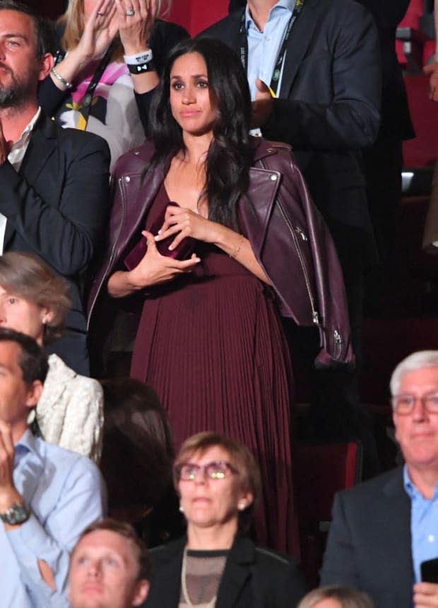 <p>Well, well, well, what's all this then? Why, it's Meghan at the opening ceremony of the Invictus Games in Toronto in <a href="https://parade.com/living/september-holidays-observances" rel="nofollow noopener" target="_blank" data-ylk="slk:September;elm:context_link;itc:0;sec:content-canvas" class="link ">September</a> 2017. Which happened to be founded by Prince Harry, who was also in attendance, but we're sure that's irrelevant ... Anyway, look how beautiful Meghan is in that burgundy chiffon dress and coordinating burgundy leather jacket!</p>