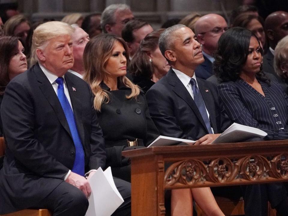 Former President Donald Trump, and First Lady Melania Trump, President Barack Obama and First Lady Michelle Obama attend the state funeral of former US president George H.W. Bush at the Washington National Cathedral in Washington, DC, December 5, 2018.