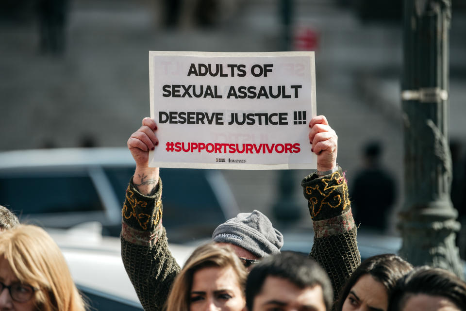 A demonstrator holds a sign overhead at a rally in support of the Adult Survivors Act on February 28, 2020 in New York City. Introduced by New York State Senator Brad Hoylman and Assemblymember Linda Rosenthal in October 2019, the ASA would provide a one year look back window for any adult survivor of sexual abuse to sue his or her abuser in civil court, even if the statute of limitations has expired.