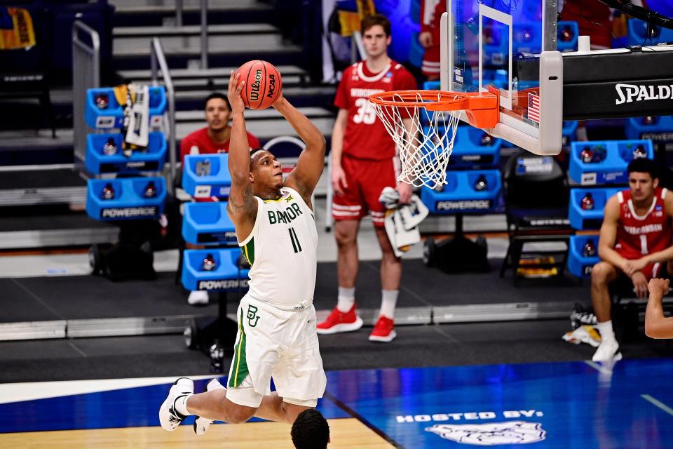Baylor's Mark Vital dunks against Wisconsin during the first half in the second round of the men's 2021 NCAA Tournament at Hinkle Fieldhouse.