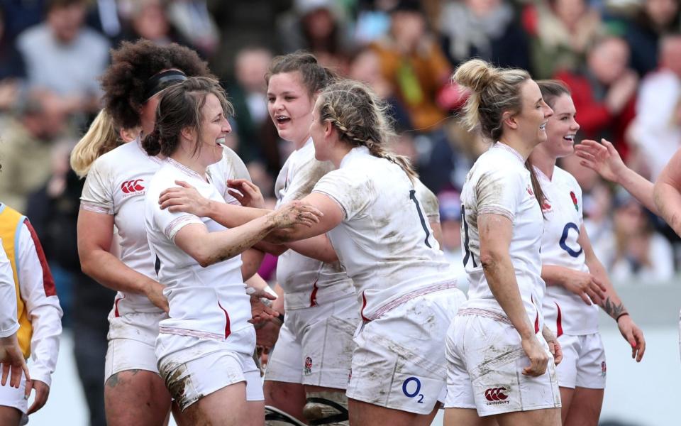 England's Katy McLean after scoring their third try. - REUTERS