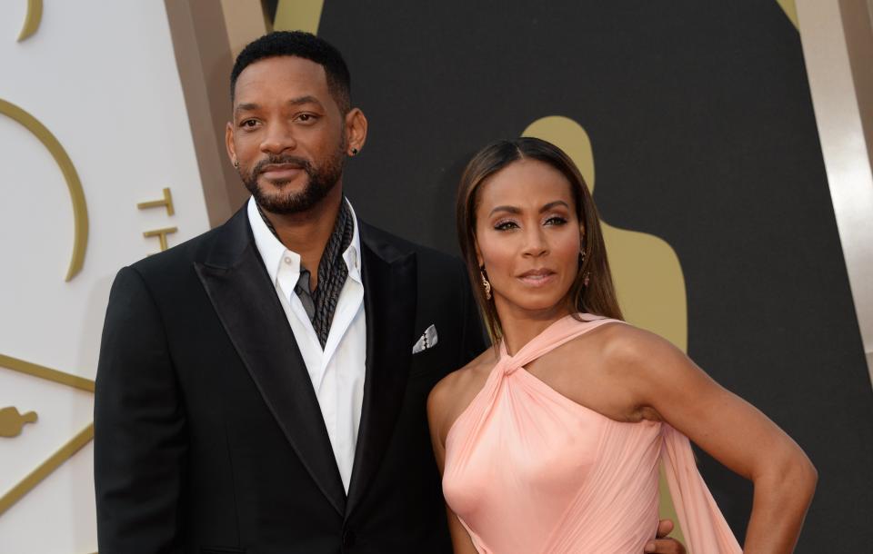 Actrors Will Smith and Jada Pinkett Smith arrive on the red carpet for the 86th Academy Awards on March 2nd, 2014 in Hollywood, California. AFP PHOTO / Robyn BECK        (Photo credit should read ROBYN BECK/AFP/Getty Images)