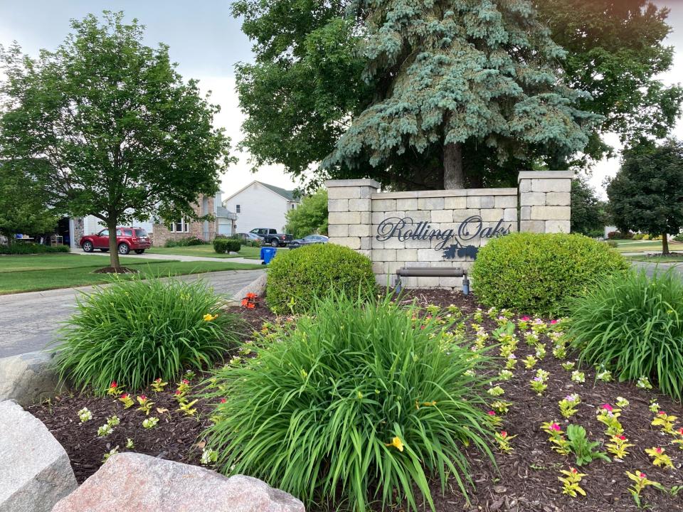 A sign marks the entrance to the Rolling Oaks subdivision in Howell.