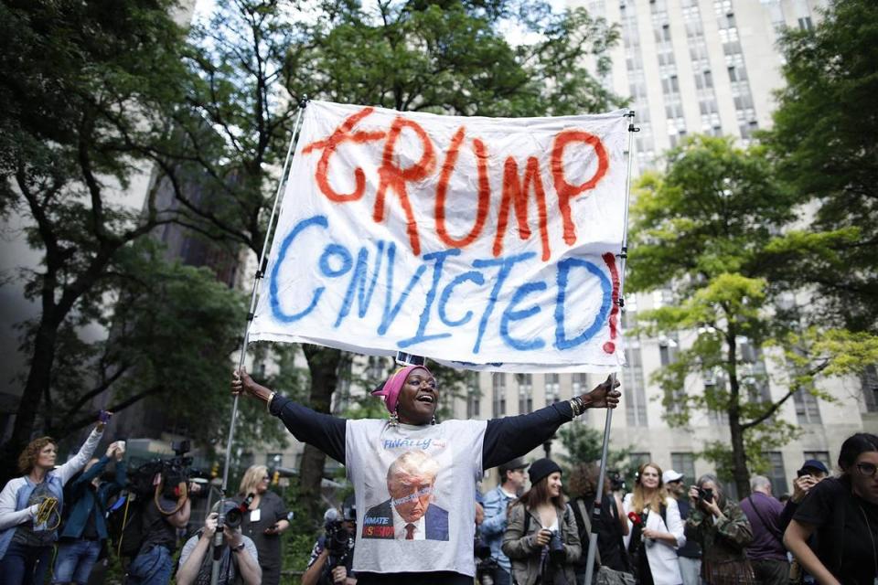 People react after former President and Republican presidential candidate Donald Trump was convicted in his criminal trial, outside of Manhattan Criminal Court in New York City on May 30, 2024. The jury convicted Donald Trump on all 34 charges.