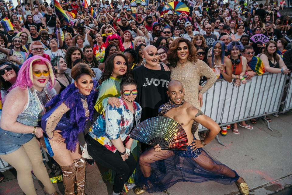 Performers pose for a group shot with the crowd at the end of their performances on Saturday, June 11, 2022, during a drag show hosted by Tyler Cooper aka Sabin for the Motor City Pride Festival at Detroit's Hart Plaza.