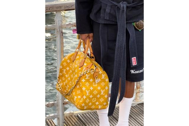 Pharrell shows off the 'Millionaire' Louis Vuitton duffle bag