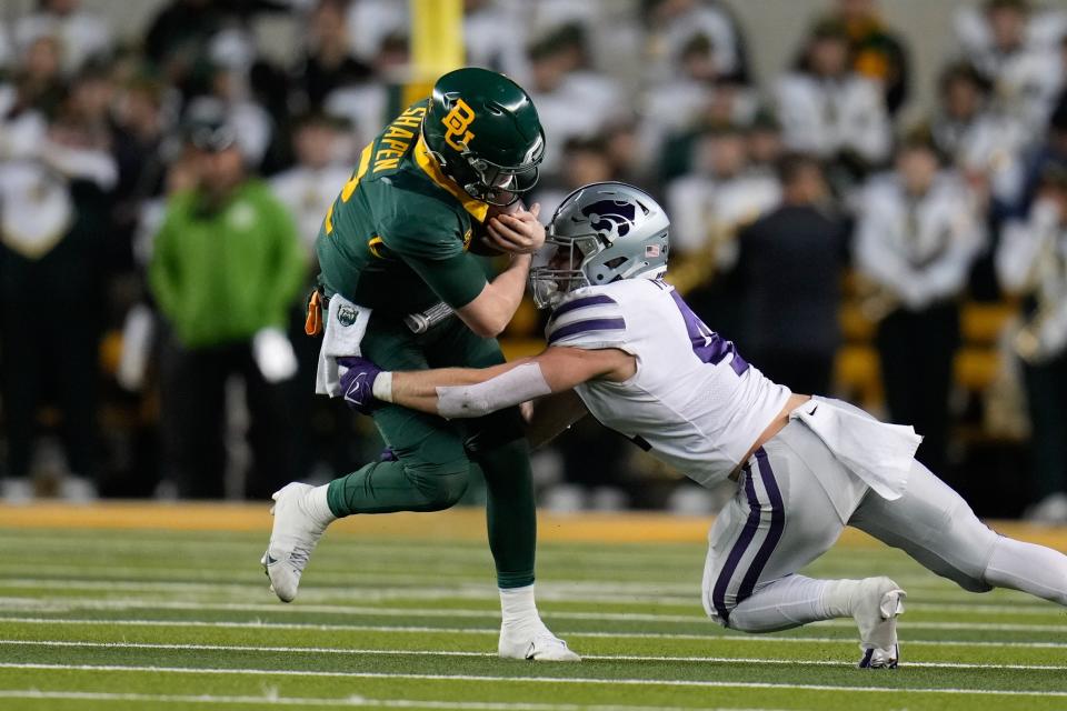 Kansas State linebacker Austin Moore (41) is one of several Wildcat defensive players returning for a super-senior fifth season in 2024.