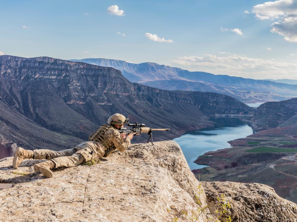 A sniper on a cliff