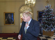 Britain's Prime Minister Boris Johnson prepares to leave 10 Downing Street to travel to Buckingham Palace, London, to meet with Queen Elizabeth II on Friday, Dec. 13, 2019. Prime Minister Boris Johnson's Conservative Party has won a solid majority of seats in Britain's Parliament — a decisive outcome to a Brexit-dominated election that should allow Johnson to fulfil his plan to take the U.K. out of the European Union next month. (Stefan Rousseau/Pool via AP)