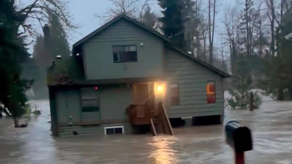 PHOTO: A house is inundated by flood waters in Granite Falls, Wash., Dec. 5, 2023.  (Kira Mascorella via AP)