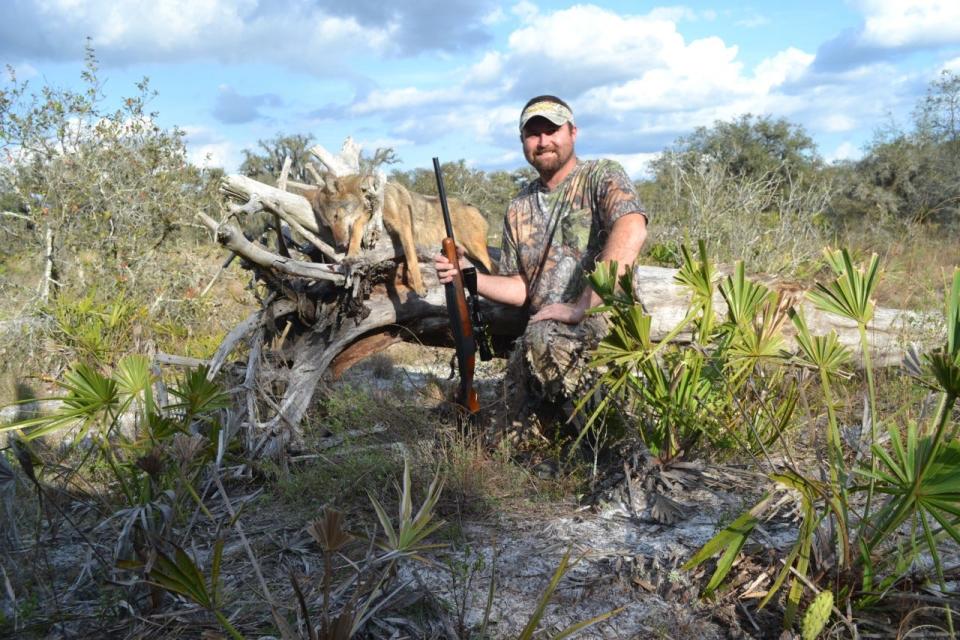 Hunting columnist Ian Nance with a Fort Meade coyote. COURTESY PHOTO