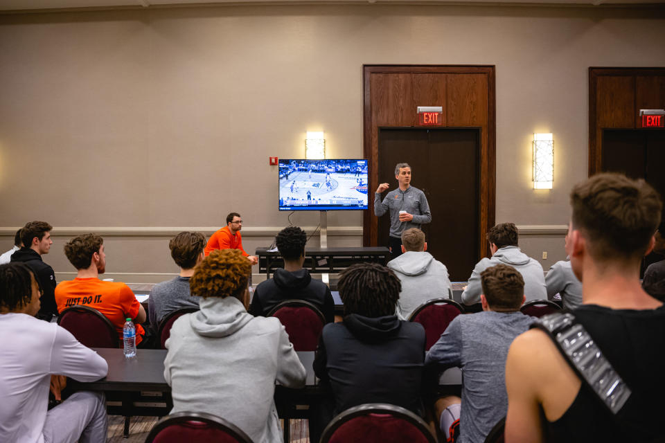 Mitch Henderson reviews footage of a recent Creighton game during a team meeting at the hotel.<span class="copyright">Jon Cherry for TIME</span>