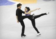 Tessa Virtue and Scott Moir from Canada perform in the Ice Dance Short Dance program at the ISU Four Continents Figure Skating Championships in Gangneung, South Korea, Thursday, Feb. 16, 2017. (AP Photo/Ahn Young-joon)