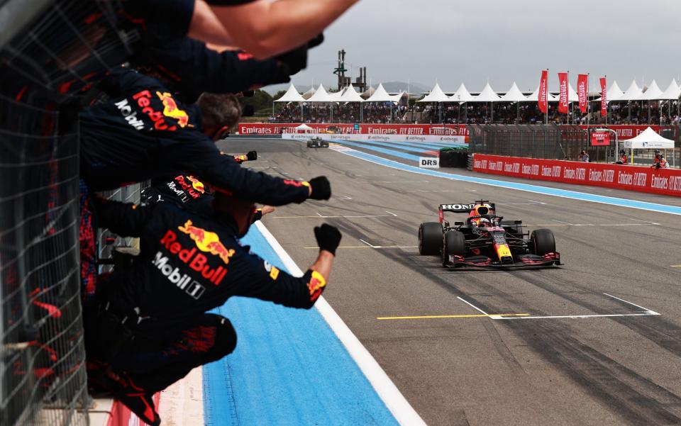 Red Bull Racing team members celebrate on the pitwall as Max Verstappen of the Netherlands driving the (33) Red Bull Racing RB16B Honda crosses the finish line to win during the F1 Grand Prix of France at Circuit Paul Ricard on June 20, 2021 in Le Castellet, France - Mark Thompson/Getty Images