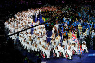 LONDON, ENGLAND - AUGUST 29: Wheelchair tennis player Peter Norfolk of Great Britain carries the flag during the Opening Ceremony of the London 2012 Paralympics at the Olympic Stadium on August 29, 2012 in London, England. (Photo by Gareth Copley/Getty Images)