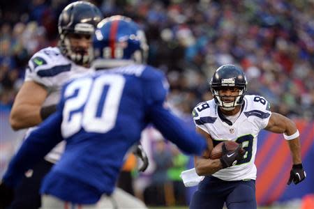 Dec 15, 2013; East Rutherford, NJ, USA; Seattle Seahawks wide receiver Doug Baldwin (89) runs the ball against the New York Giants during the second half at MetLife Stadium. Mandatory Credit: Joe Camporeale-USA TODAY Sports