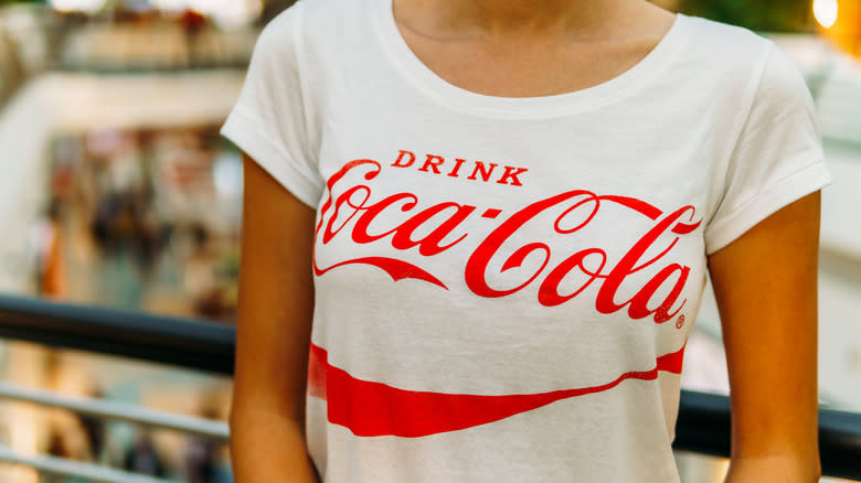 Woman wearing a coca cola shirt