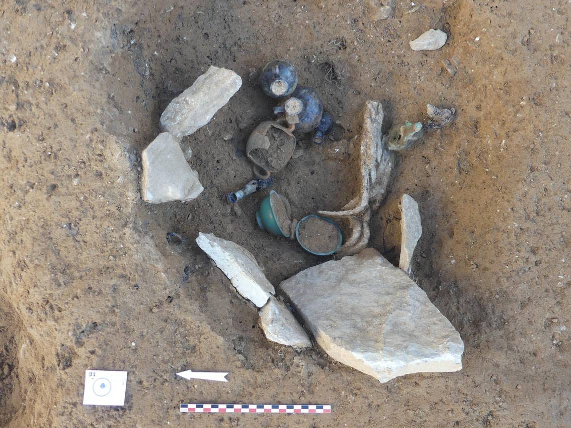 Bowls, vases and lamps were found buried with the remains, archaeologists said.