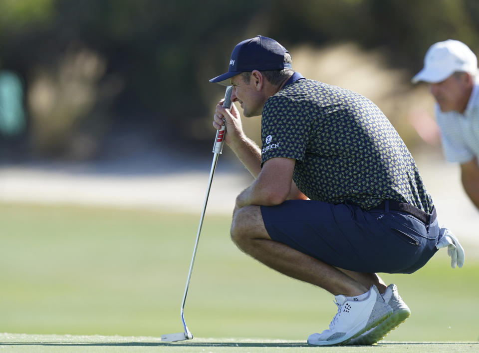 Justin Rose, of England, studies his putt during a Pro-Am tournament ahead of the Hero World Challenge PGA Tour at the Albany Golf Club, in New Providence, Bahamas, Wednesday, Dec. 1, 2021.(AP Photo/Fernando Llano)
