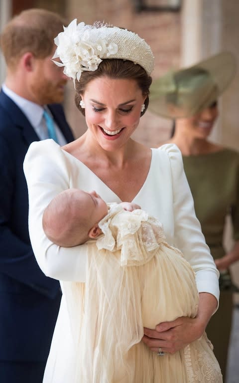 Catherine, Duchess of Cambridge carries Prince Louis as they arrive for his christening service at the Chapel Royal, St James's Palace, in London on Monday 9th July - Credit: Dominic Lipinski