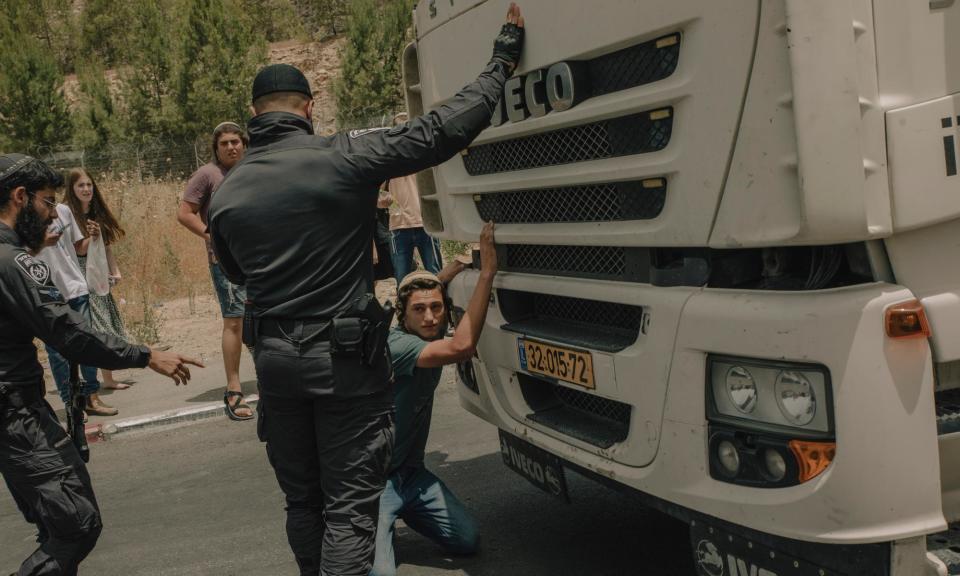 <span>Those blocking the vehicles say the aid is being diverted by Hamas instead of being delivered to civilians in need – a claim relief agencies reject.</span><span>Photograph: Alessio Mamo/The Guardian</span>