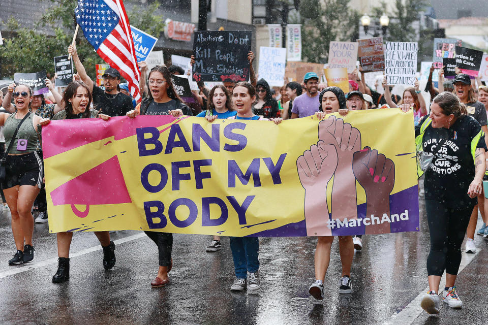 Demonstrators march in the rain during an abortion rights rally (Stephen M. Dowell / Orlando Sentinel / TNS via Getty Images file)