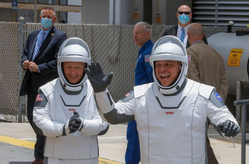 NASA astronauts Douglas Hurley and Robert Behnken head to launch pad 39 to board a SpaceX Falcon 9 rocket during NASA's SpaceX Demo-2 mission to the International Space Station from NASA's Kennedy Space Center in Cape Canaveral