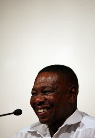 FILE PHOTO: Blade Nzimande, secretary general of South Africa's Communist Party (SACP), smiles while addressing the media in Havana November 6, 2006. REUTERS/Claudia Daut (CUBA)/File Photo