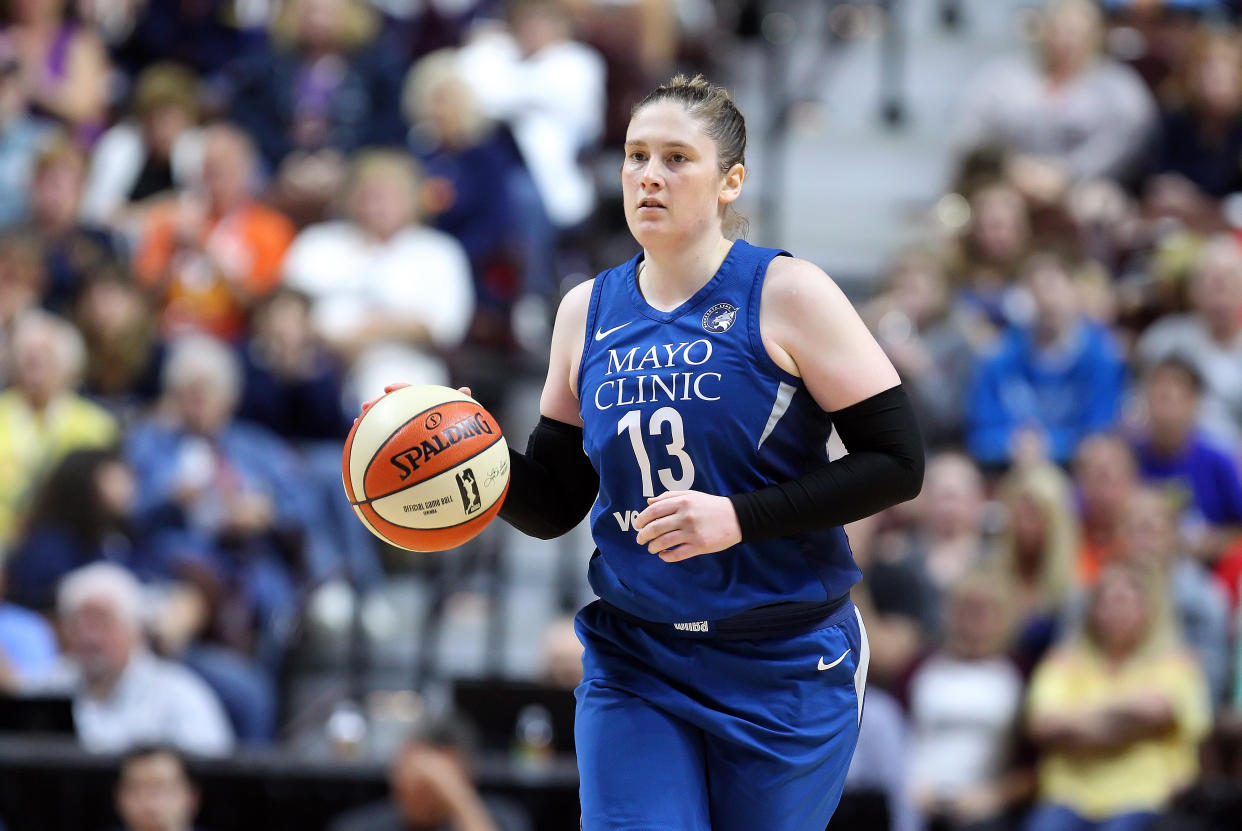 Minnesota Lynx guard Lindsay Whalen brings the ball up court during a 2018 game against the Connecticut Sun, the team that drafted her in 2004. (M. Anthony Nesmith/Icon Sportswire via Getty Images)