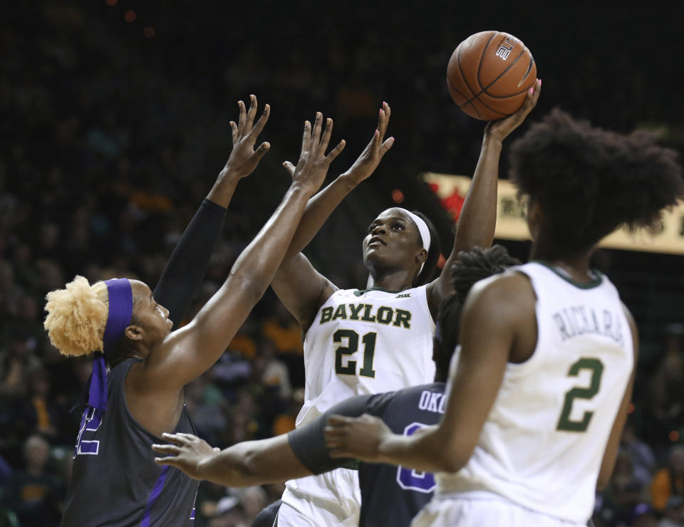 Baylor center Kalani Brown, right, scores over TCU center Jordan Moore, left, in the second half of an NCAA college basketball game, Saturday, Feb. 9, 2019, in Waco, Texas. Baylor won 89-71. (AP Photo/Rod Aydelotte)