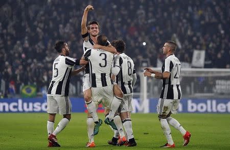 Football Soccer - Juventus v Atalanta - Italian Serie A - Juventus stadium, Turin, Italy - 3/12/16 - Juventus' Daniele Rugani celebrates with teammates after scoring second goal . REUTERS/Giorgio Perottino