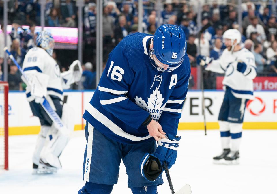 Toronto Maple Leafs right wing Mitch Marner skates off as the Tampa Bay Lightning celebrate their Game 7 victory.