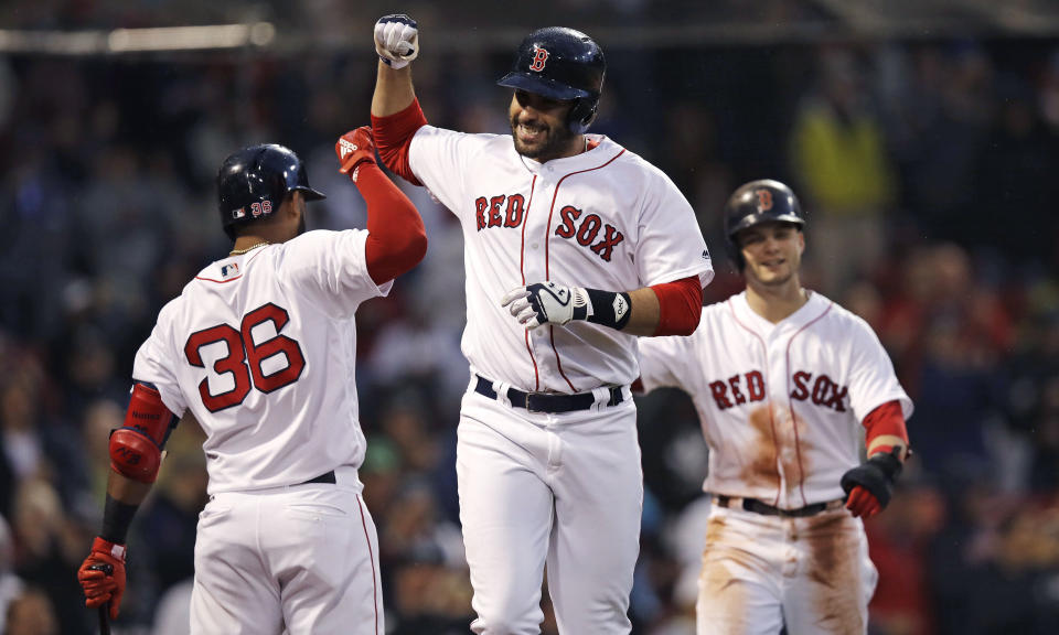 Remember when the Red Sox didn't have power last season? J.D. Martinez (center) certainly has changed that. (AP)