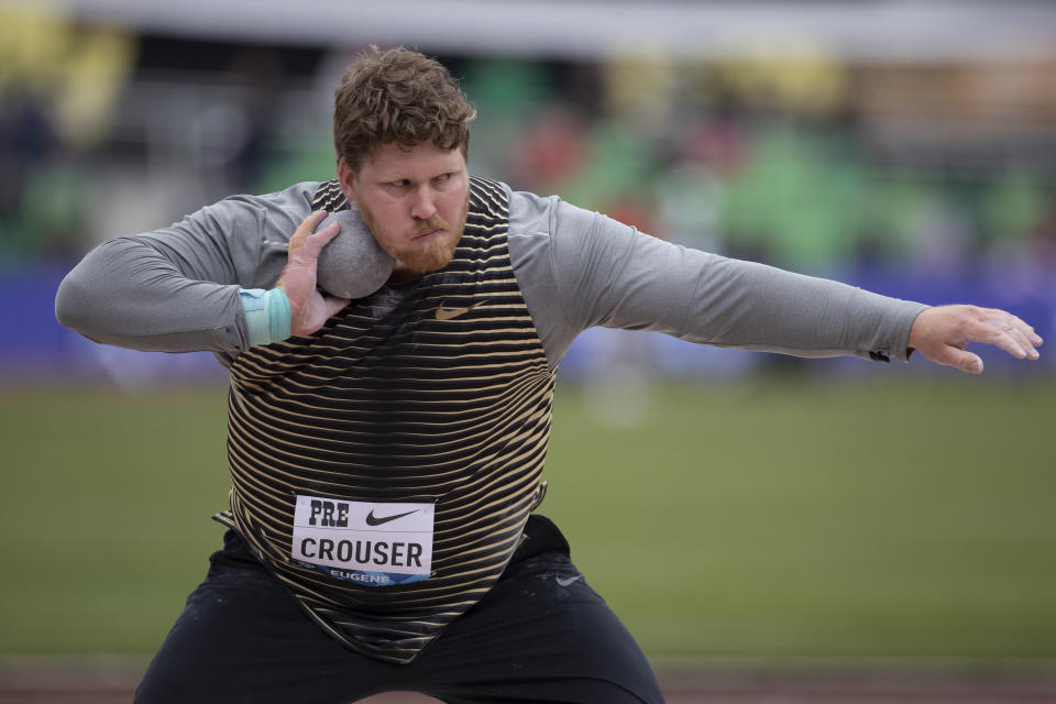 FILE - The United States' Ryan Crouser competes in the men's shot put during the Prefontaine Classic track and field meet at Hayward Field Saturday, May 28, 2022, in Eugene, Ore. Among those who might break their own world records are hurdlers Sydney McLaughlin and Karsten Warholm and shot putter Ryan Crouser. Jamaican speedster Elaine Thompson-Herah could make a run at 100-meter record that Florence Griffith-Joyner has held since 1988. (AP Photo/Amanda Loman, File)