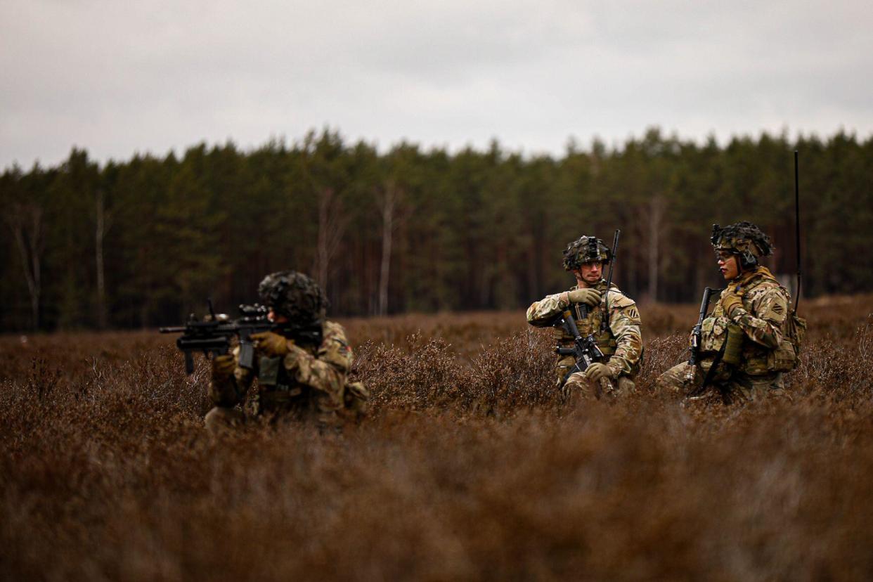 U.S. Soldiers assigned to Bandits Company, 3rd Battalion, 15th Infantry Regiment, 2nd Armored Brigade Combat Team, 3rd Infantry Division, relays information to his troops during a squad live-fire exercise at Karliki, Poland, Jan.23, 2024. The 3rd Infantry Division’s mission in Europe is to engage in multinational training and exercises across the continent, working alongside NATO Allies and regional security partners to provide combat-credible forces to V Corps, America’s forward deployed corps in Europe. (U.S. Army Photo by Sgt. Michael Udejiofor)