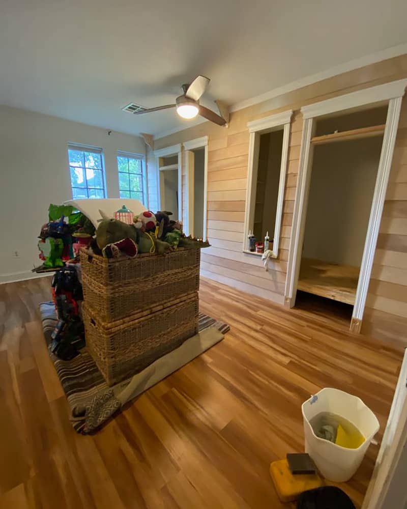 white and wood panel kids bedroom during makeover process