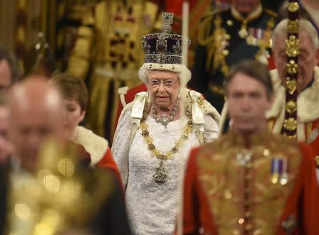 Britain's Queen Elizabeth proceeds through the Royal Gallery before the State Opening of Parliament in the House of Lords, at the Palace of Westminster in London, Britain May 18, 2016. REUTERS/Toby Melville