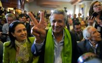 The Ecuadorean presidential candidate of the ruling Alianza PAIS party, Lenin Moreno, next to his wife Rocio Gonzalez (L), listens to the first results of the runoff election, in Quito on April 2, 2017