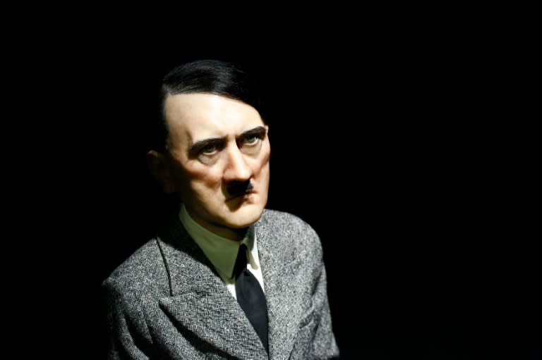 The statue "Him", by artist Maurizio Cattelan, depicts Hitler on his knees with his hands clasped together as he gazes upward